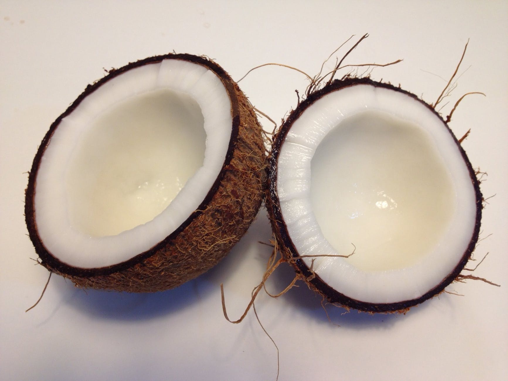 coconut fruit sliced into two